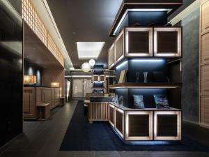 a lobby of a building with wooden cabinets at Hotel Vista Nagoya Nishiki in Nagoya