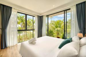 Ένα ή περισσότερα κρεβάτια σε δωμάτιο στο May Villa Hoi An-4Brs +21 φωτογραφίες