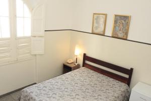 Cama ou camas em um quarto em Sul América Palace Hotel