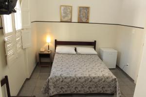 Cama ou camas em um quarto em Sul América Palace Hotel