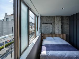 Arcade Hotel房間的床