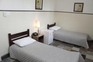Cama ou camas em um quarto em Sul América Palace Hotel