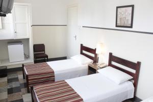 Cama ou camas em um quarto em Sul América Palace Hotel
