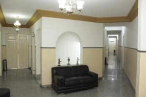 Uma área de estar em Sul América Palace Hotel