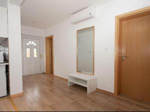 a living room with a mirror and a door at Apartment Josipa- Two-Bedroom Apartment in Rakovica +19 photos