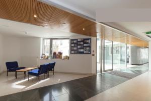 a room with two chairs and a table in a building at Friendship House (Southwark) in London