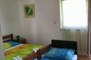 Postel nebo postele na pokoji v ubytování Apartments Vala - Studio Apartment A3