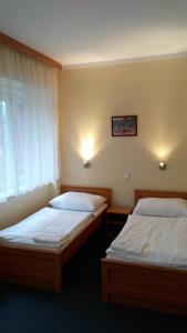 Postel nebo postele na pokoji v ubytování Parkhotel Terezín