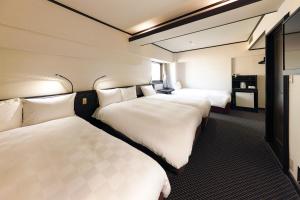 Postel nebo postele na pokoji v ubytování Hotel Consort Shin-Osaka + 37 fotografií
