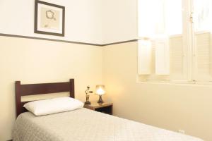Cama ou camas em um quarto em Sul América Palace Hotel