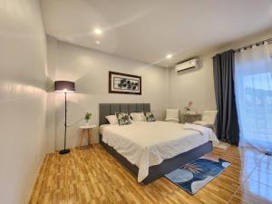 Ένα ή περισσότερα κρεβάτια σε δωμάτιο στο Mama's Cozy Studio - Patong Beach +74 φωτογραφίες