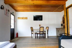 a dining room with a table and chairs at Domeniul Roa in Avrig