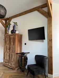 TV a/nebo společenská místnost v ubytování Logement de Pauw