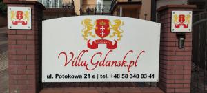 a sign for a villa garantiana restaurant at Villa Gdańsk in Gdańsk