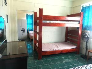 Letto o letti in una camera di Samoan Highland Hideaway