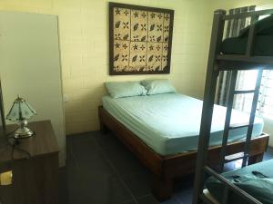 Letto o letti in una camera di Samoan Highland Hideaway