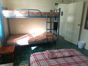 Letto o letti in una camera di Samoan Highland Hideaway