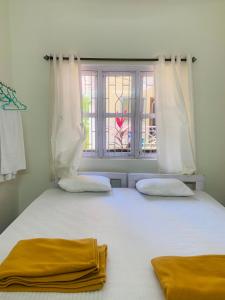 Postel nebo postele na pokoji v ubytování Palolem Paradise Guest House