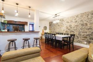 a kitchen and dining room with a table and chairs at GuestReady - Peaceful haven in Funchal in Funchal