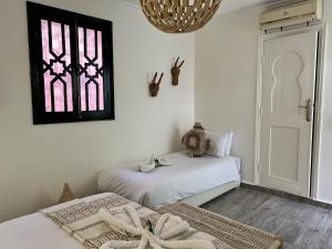 Letto o letti in una camera di RIAD RIME QOUSSAI