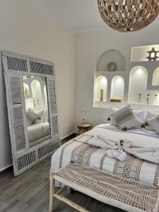 Letto o letti in una camera di RIAD RIME QOUSSAI