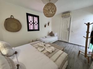 Letto o letti in una camera di RIAD RIME QOUSSAI