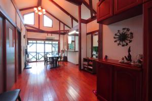 a living room with a table and a dining room at Takahira Base in Yakushima