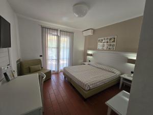 Ein Bett oder Betten in einem Zimmer der Unterkunft Hotel Mare