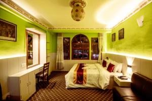 Postel nebo postele na pokoji v ubytování Hotel Pomelo House Inn