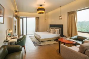 Voodi või voodid majutusasutuse Udman Hotel Greater Noida toas