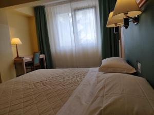 Postelja oz. postelje v sobi nastanitve Albergo Conte Max
