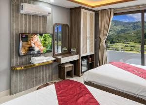 Postel nebo postele na pokoji v ubytování Boutique En Hotel Sapa