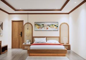 Postel nebo postele na pokoji v ubytování Boutique En Hotel Sapa