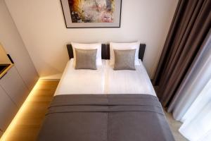 Postel nebo postele na pokoji v ubytování Hessnery Hotel