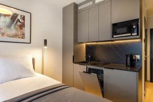 Kuchyň nebo kuchyňský kout v ubytování Hessnery Hotel