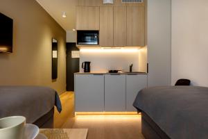 Kuchyň nebo kuchyňský kout v ubytování Hessnery Hotel