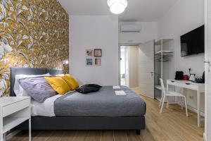 Postel nebo postele na pokoji v ubytování Del Frate Guest House Vatican