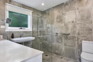 a bathroom with a shower and a sink at Hampden Neuve - Luxury Georgian Cottage in Hobart