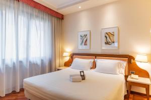 Postel nebo postele na pokoji v ubytování B&B Hotel Firenze Pitti Palace al Ponte Vecchio