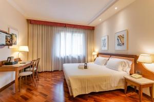 Postel nebo postele na pokoji v ubytování B&B Hotel Firenze Pitti Palace al Ponte Vecchio