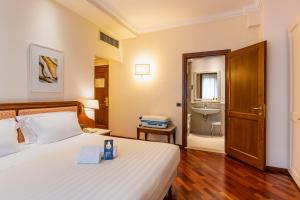 Postel nebo postele na pokoji v ubytování B&B Hotel Firenze Pitti Palace al Ponte Vecchio