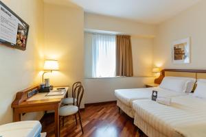Postel nebo postele na pokoji v ubytování B&B Hotel Firenze Pitti Palace al Ponte Vecchio