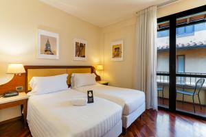 Postel nebo postele na pokoji v ubytování B&B Hotel Firenze Pitti Palace al Ponte Vecchio
