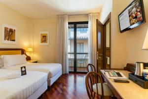 Postel nebo postele na pokoji v ubytování B&B Hotel Firenze Pitti Palace al Ponte Vecchio