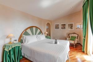 Postel nebo postele na pokoji v ubytování B&B Hotel Firenze Pitti Palace al Ponte Vecchio