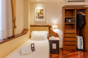 Postel nebo postele na pokoji v ubytování B&B Hotel Firenze Pitti Palace al Ponte Vecchio