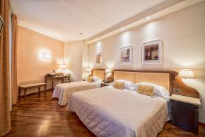 Postel nebo postele na pokoji v ubytování B&B Hotel Firenze Pitti Palace al Ponte Vecchio