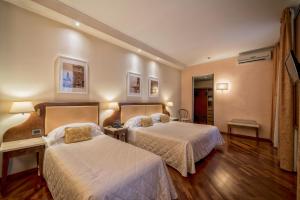 Postel nebo postele na pokoji v ubytování B&B Hotel Firenze Pitti Palace al Ponte Vecchio