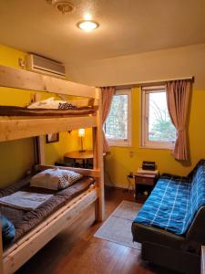 Postel nebo postele na pokoji v ubytování Bellscabin Guesthouse