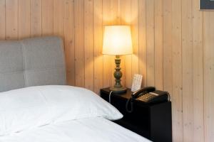 Letto o letti in una camera di Jungfrau Lodge, Swiss Mountain Hotel